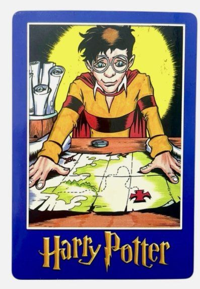 Harry Potter “Magic Will Happen” vending card: Harry bent over a map in a yellow glow
